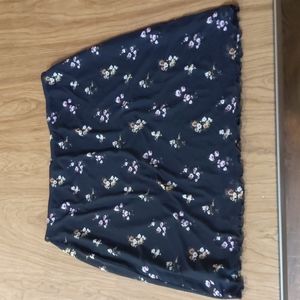 Black Skirt With Pink Flowers on the skirt.